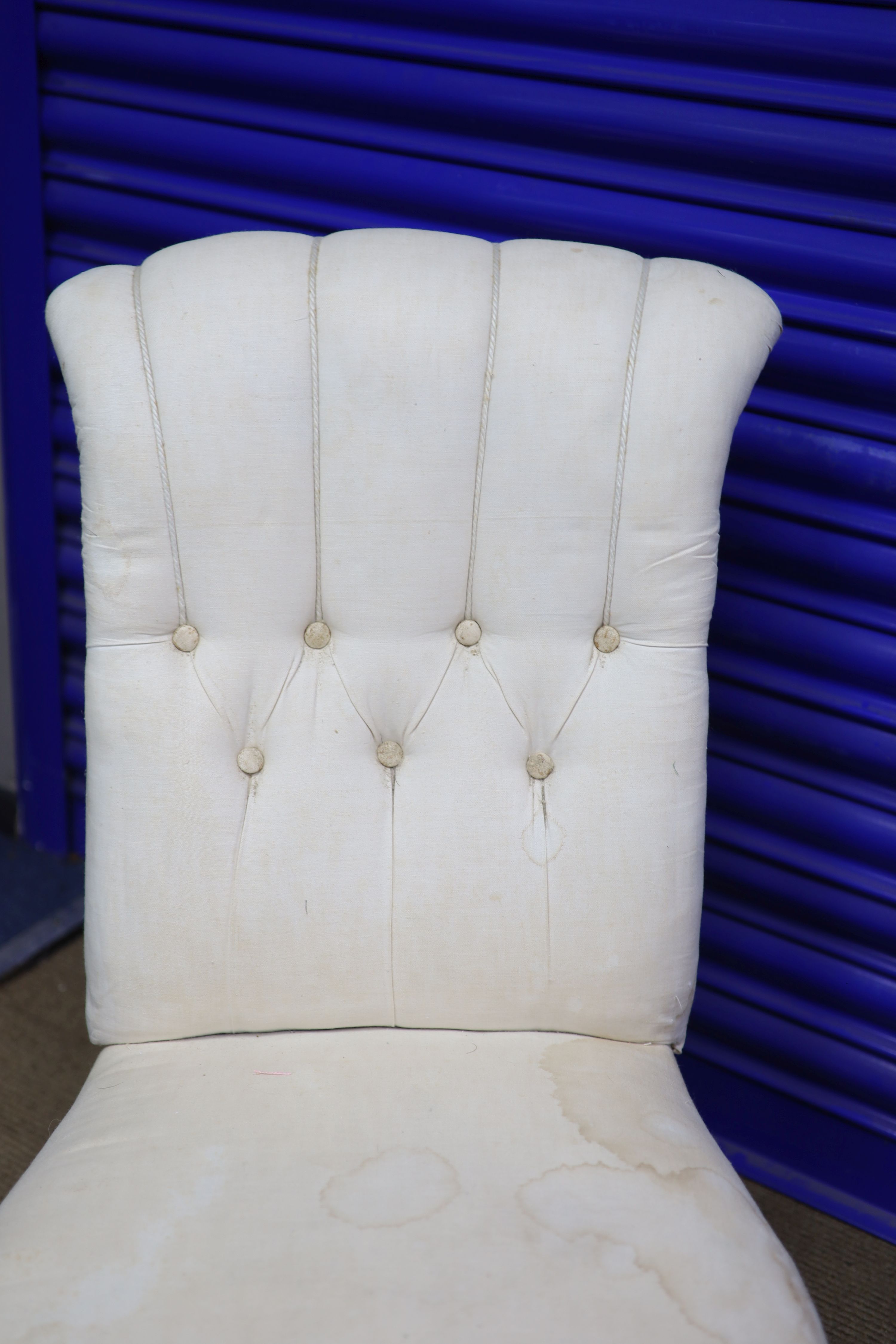 A Victorian walnut framed button back nursing chair, height 79cms width 47cms